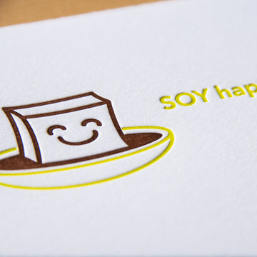 Letterpress congratulations greeting card with words Soy Happy for You and smiling tofu cube