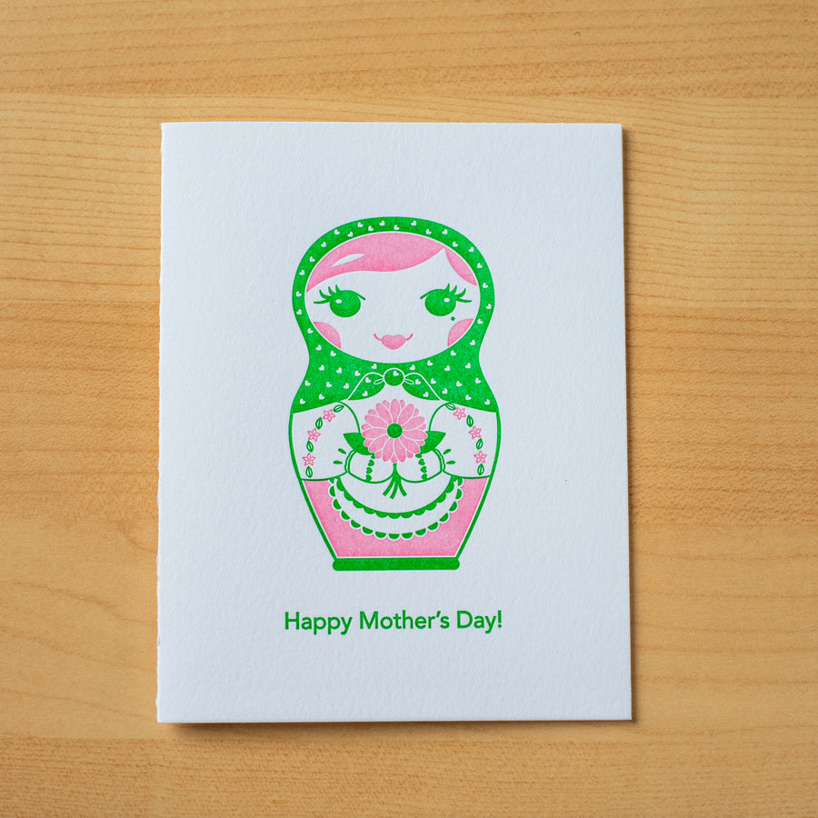 Letterpress Mother’s Day greeting card of a nesting doll holding a bouquet of flowers